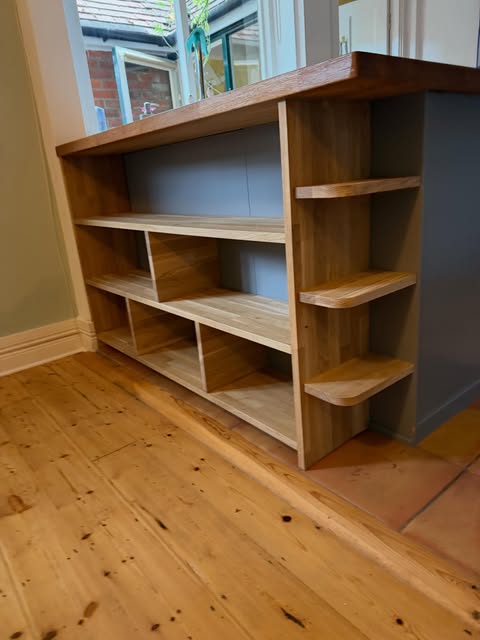 Solid timber shelving unit with curved end shelves